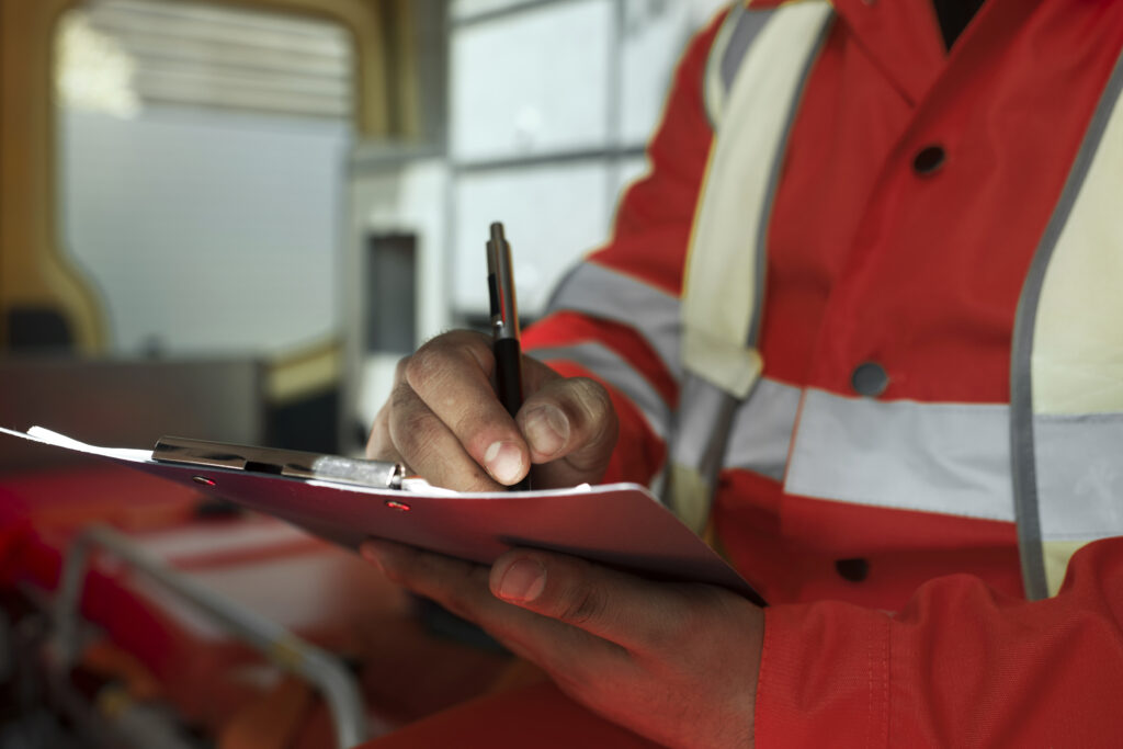 side view man taking notes ambulance car